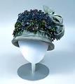 Image of Straw cloche with ribbon and fabric violet trim, 1920s